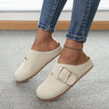 Women's brown closed toe low top canvas slippers shown from the side.