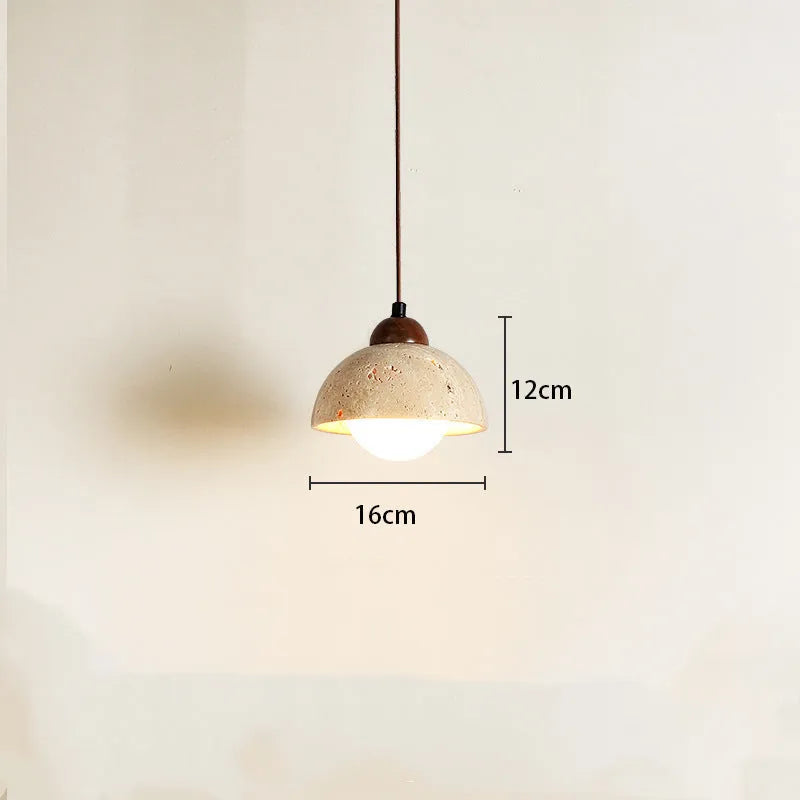 Yellow cave stone wabi sabi style marble bedside pendant light on a wooden surface