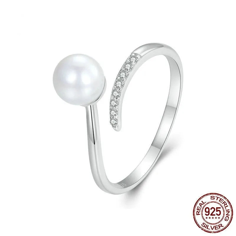 S925 sterling silver adjustable ring with shell pearl accents showing open loop design