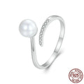 S925 sterling silver adjustable ring with shell pearl accents showing open loop design