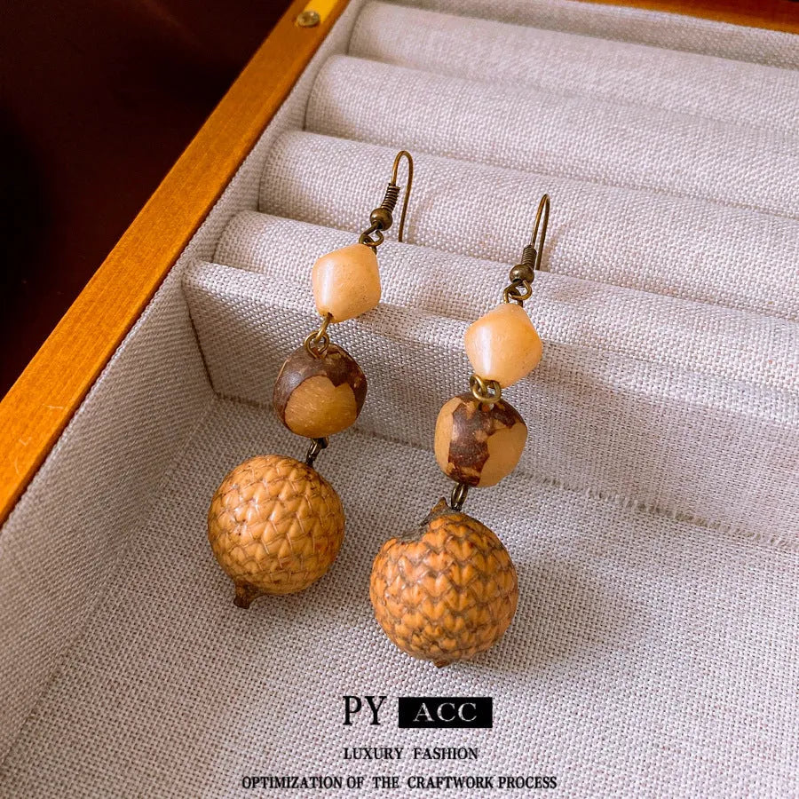 Brown resin fruit core tassel earrings with round geometric design and ear hook clasp for women