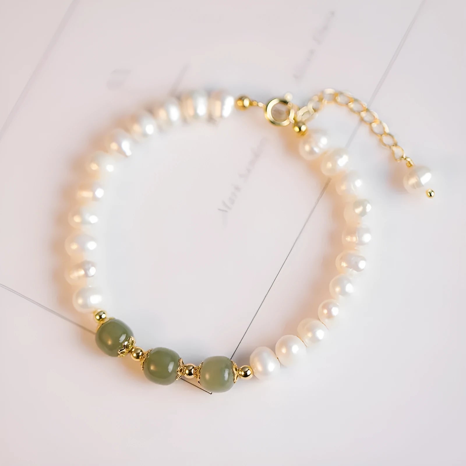 Natural freshwater pearl bracelet with diamond-shaped beads in an electroplated Hetian jade colour.