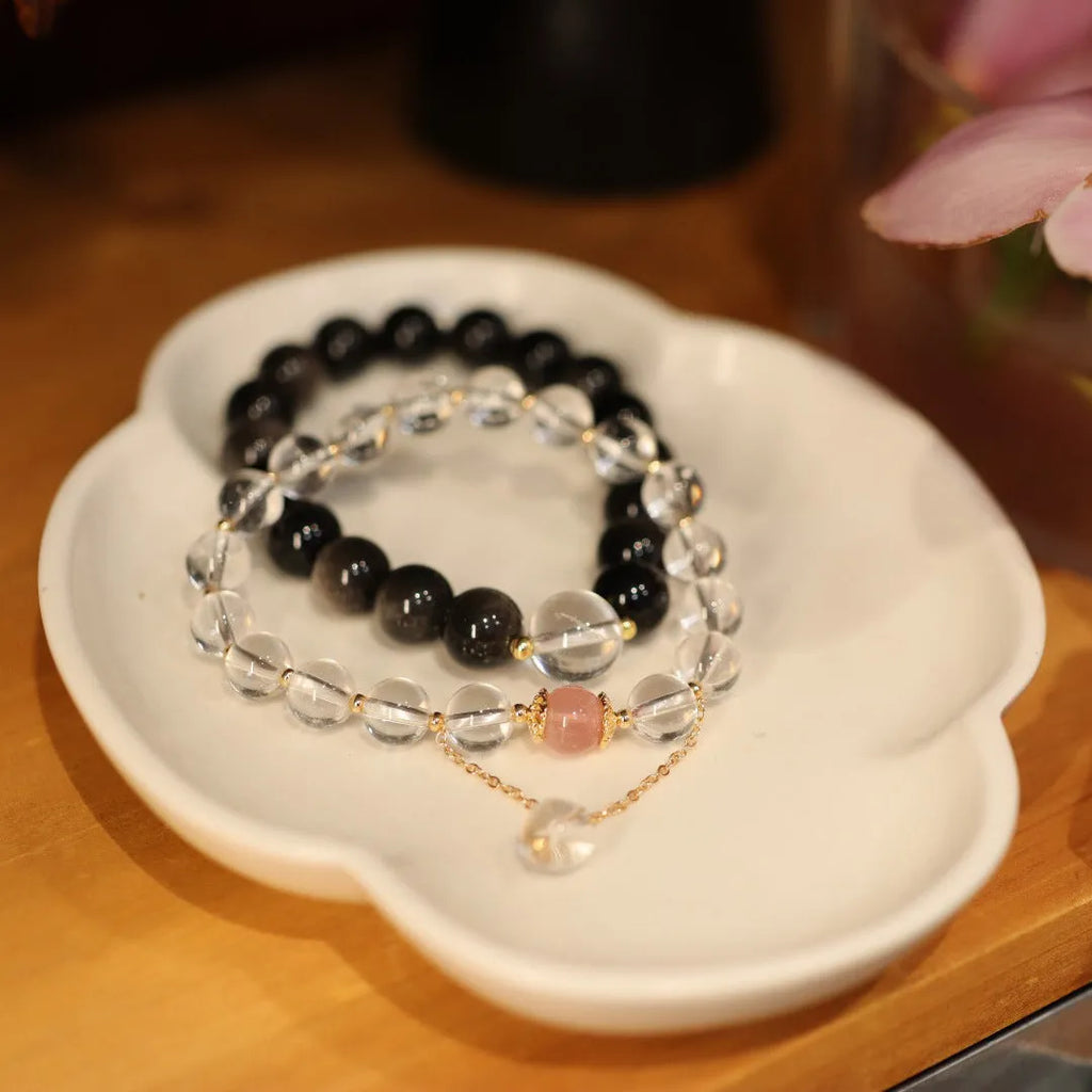 White crystal and cat eye obsidian geometric bracelet with Chinese auspicious patterns