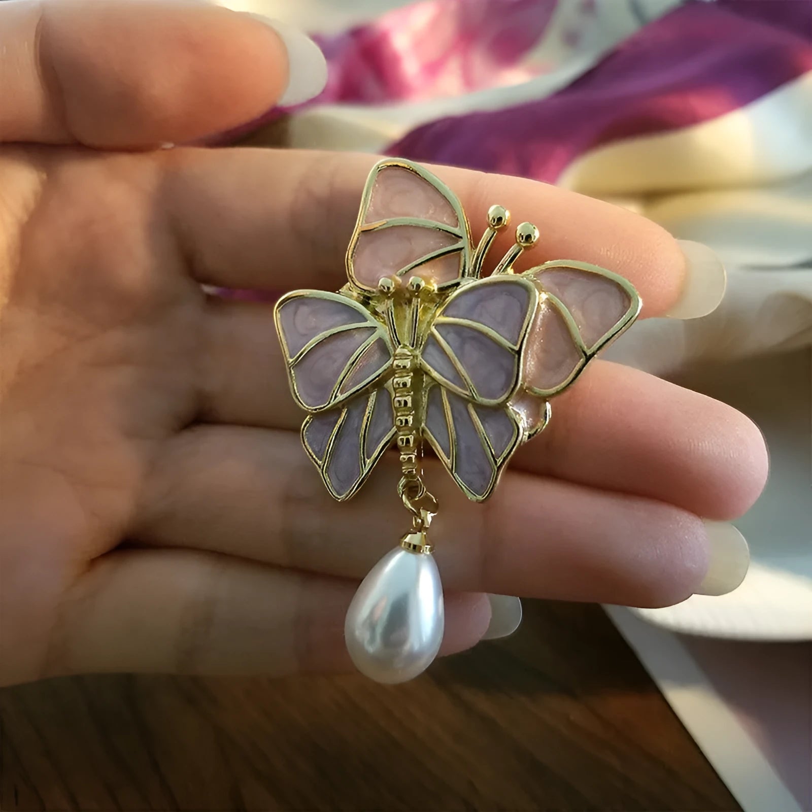 Vintage enamel butterfly brooch with pearl accents on alloy base
