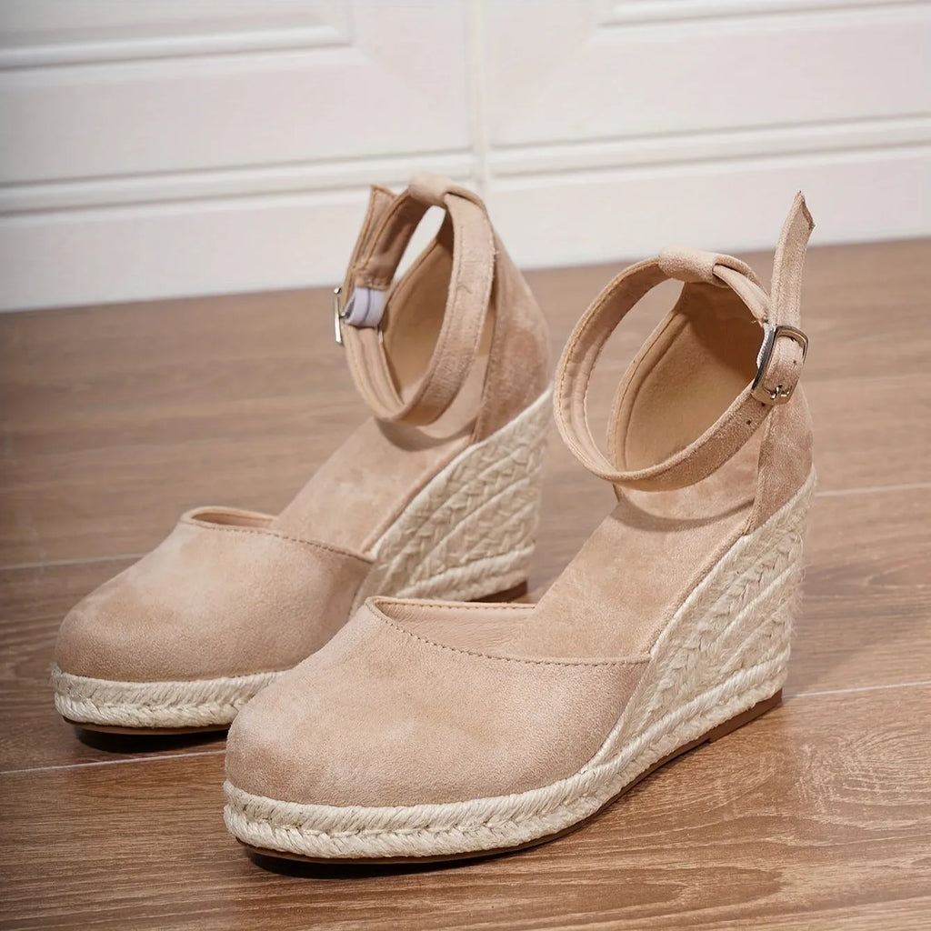 Women's apricot Roman-style canvas wedge sandals with suede upper and buckle closure