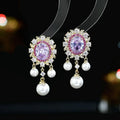 Oval geometric tassel earrings with zircon inlaid pearls in light purple, pink, or white.