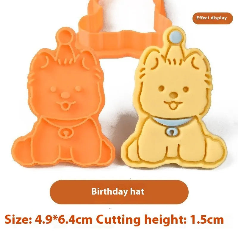 Plastic biscuit mould with puppy head designs including birthday hats and swimming rings