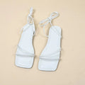 Women's flat sandals with ankle ring bandage strap and front lace-up fastening in square toe design.