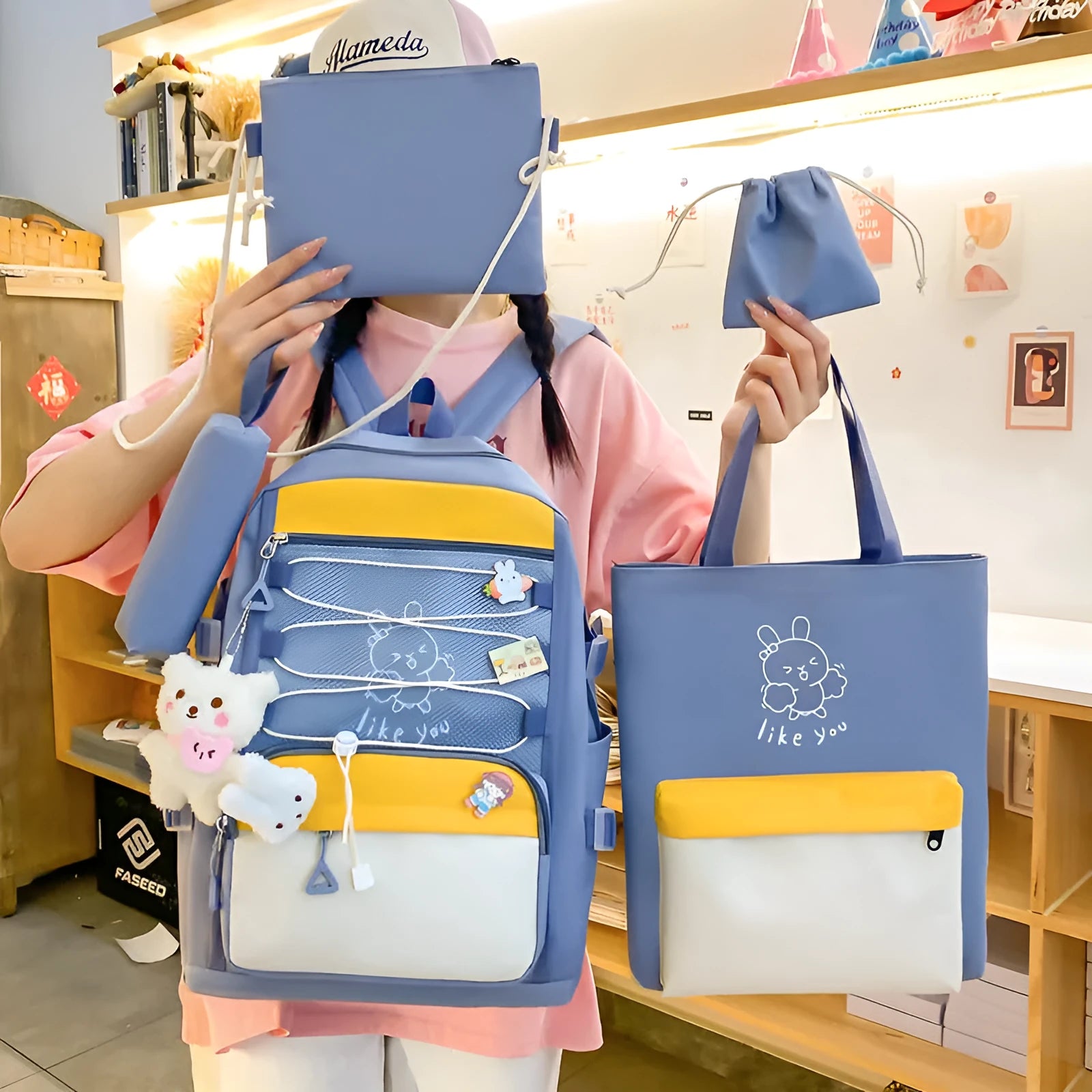 Nylon student backpack four-piece set in pink, black, purple, and blue with curved shoulder straps