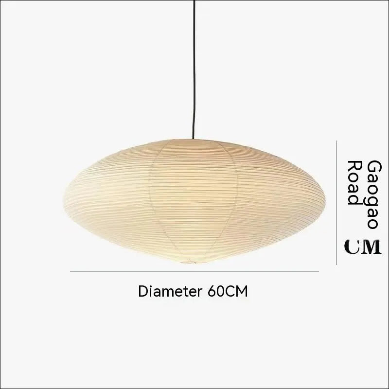 Modern simple paper pendant lamp with spherical or flat shade, shown in a bedroom or dining room setting.
