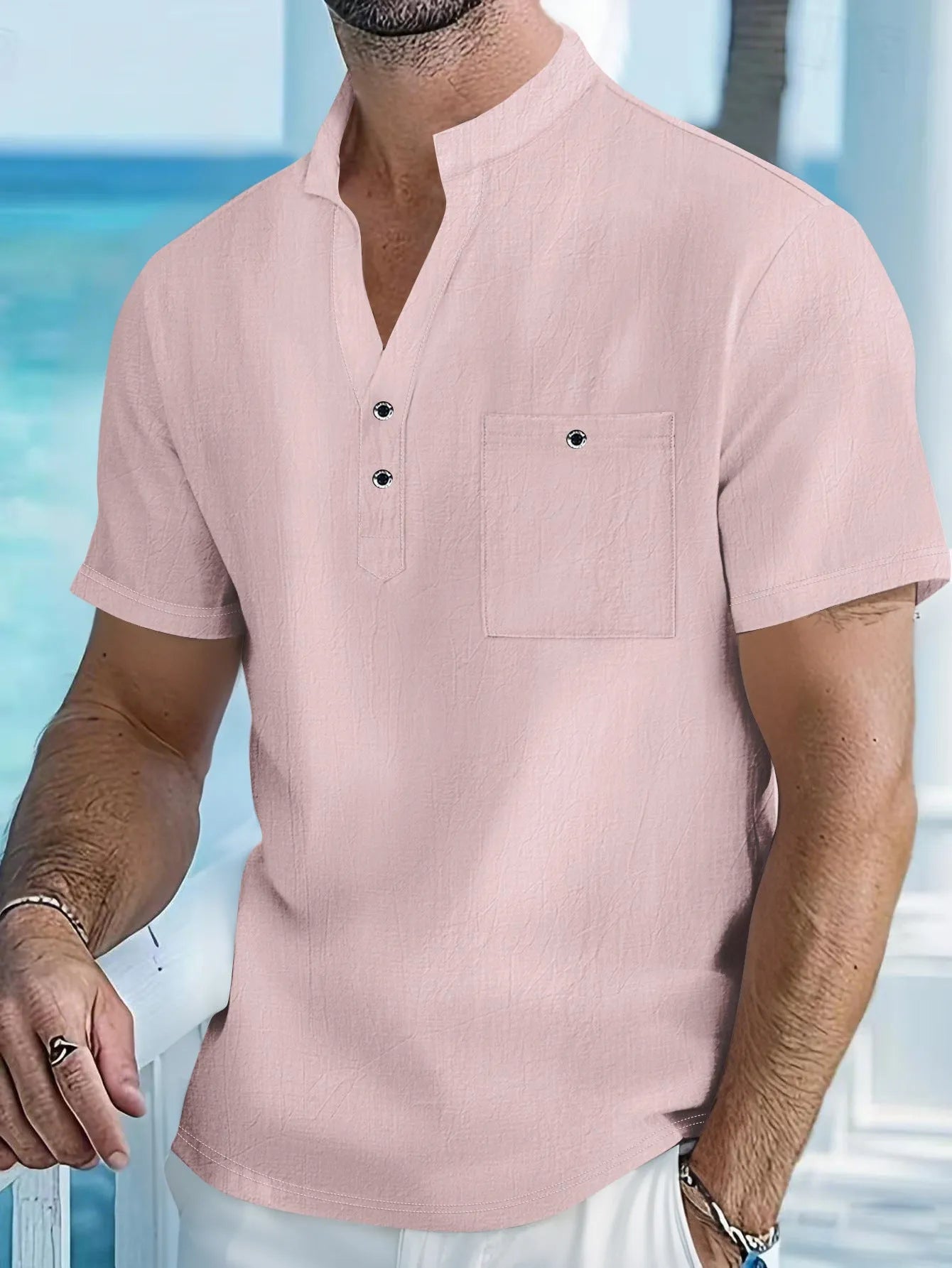 Men's loose fit linen T-shirt with a stand collar and short sleeves in a light blue colour.