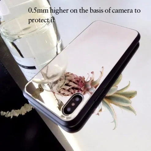 Black iPhone mirror phone case showing reflective surface on back, compatible with iPhone X and Plus models.