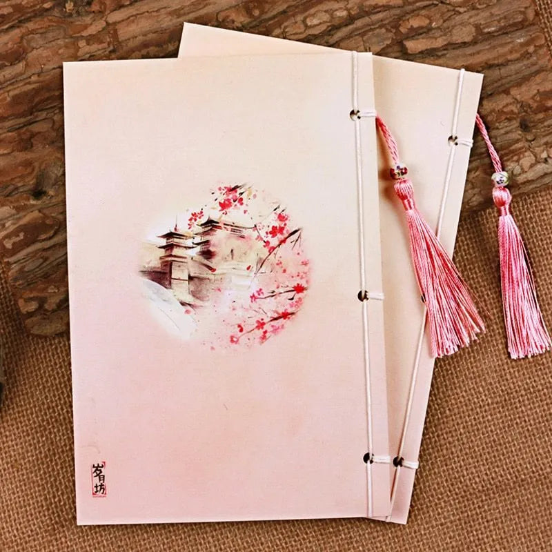 Chinese watercolour style thread-bound notebook in Azalea colour showing traditional binding and open pages