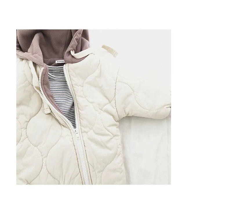 Baby padded quilted cotton kumpsuit in beige with attached hat and long sleeves, shown on a white background