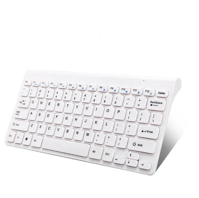 Black and white wireless keyboard and mouse set on a desk.