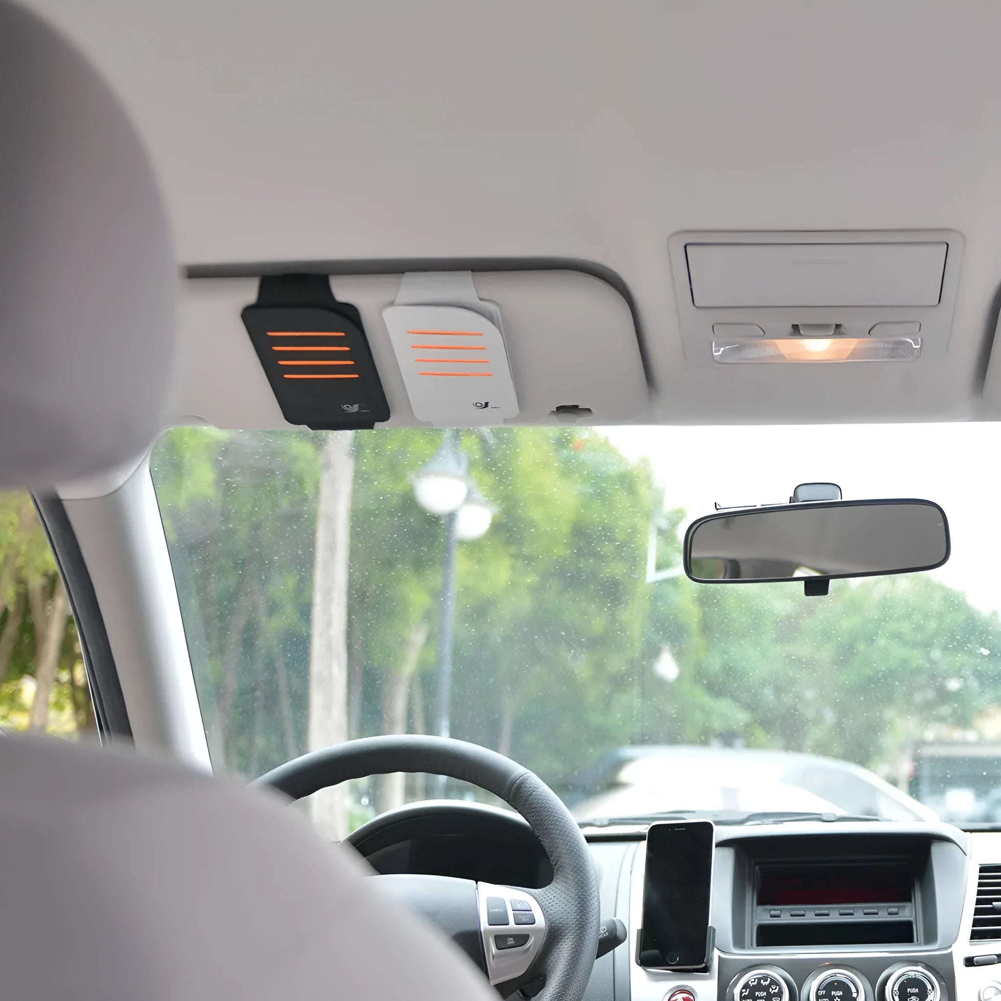Set of four tinted car window shading panels with a vehicle-mounted storage bag.