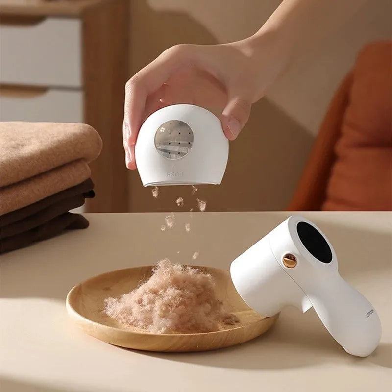 White electric lint remover with LED display showing dimensions 126x73x68mm