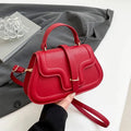 Simple PU shoulder bag in black, white or red with single strap and horizontal square shape.