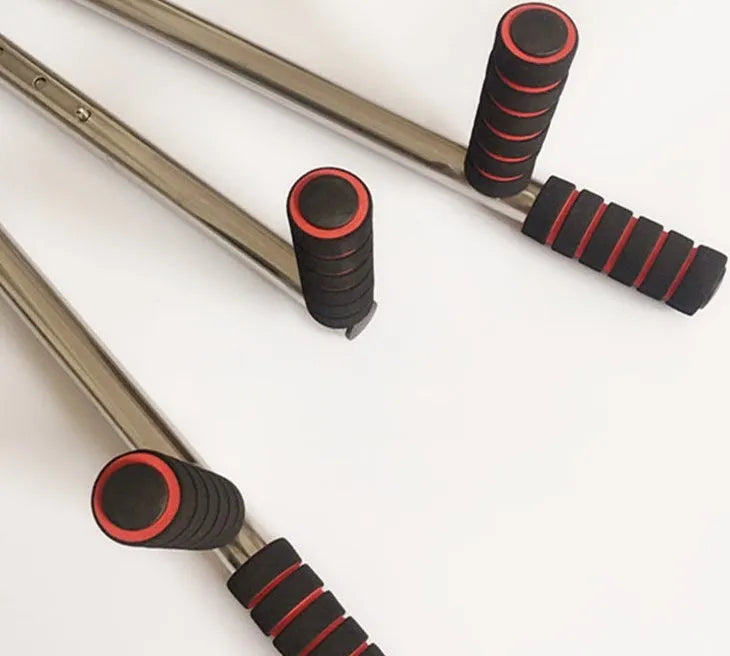 Cross fork lacing artifact leg stretcher with two extension bars, centre handle, and soft foam grips in black
