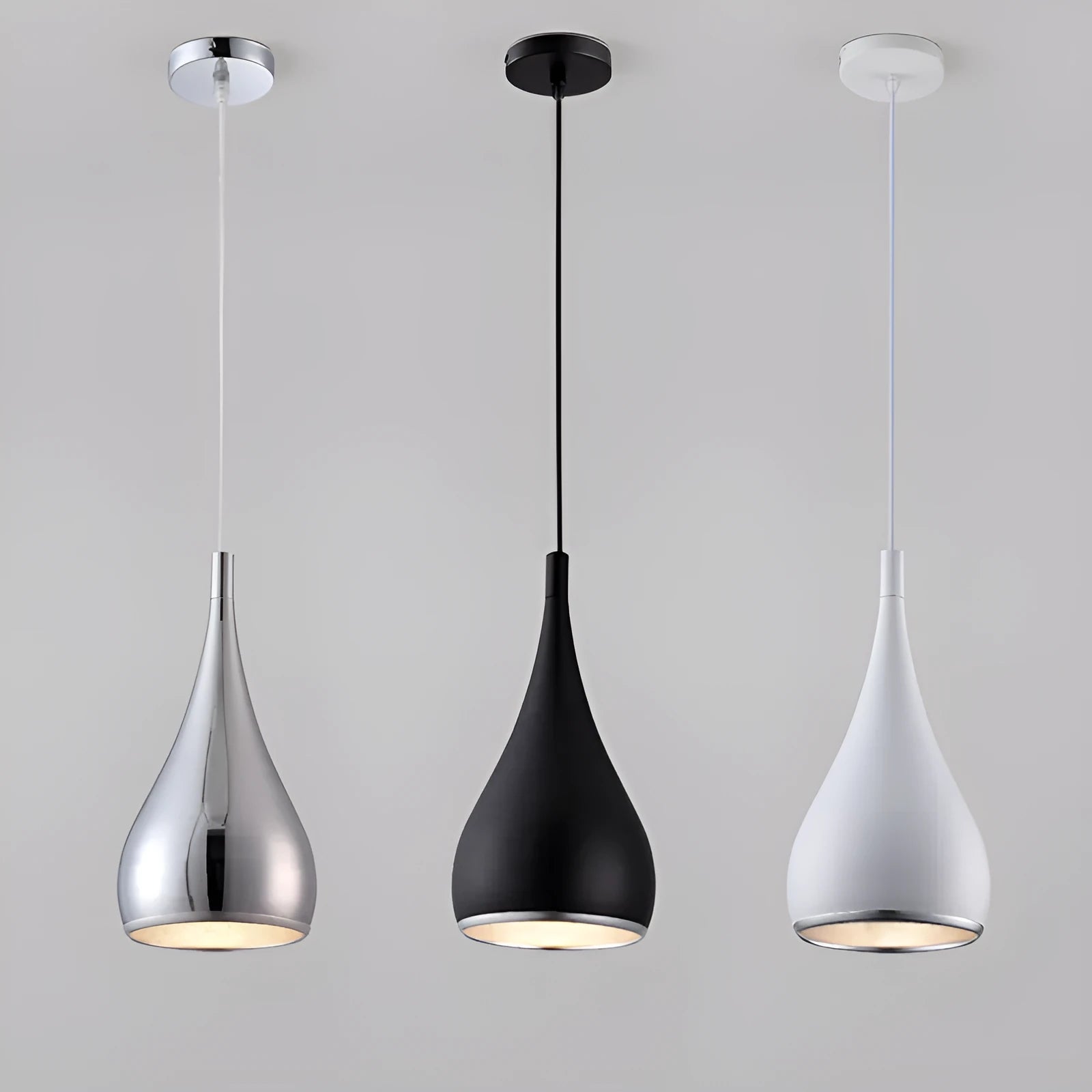 Modern minimalist iron chandelier with three light heads in a black finish, suspended from the ceiling.