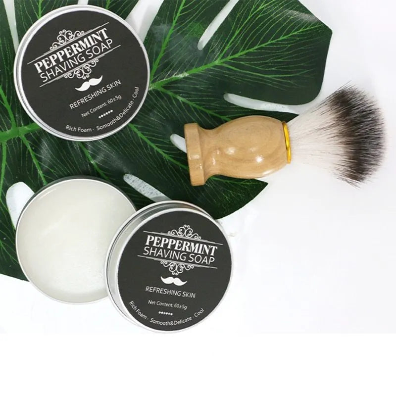 Mint scented shaving soap in aluminium box with rich foam on brush