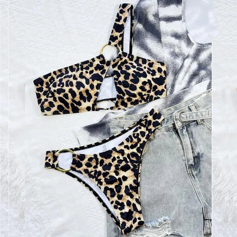 Women's leopard print polka dot bikini top and shorts on a mannequin.