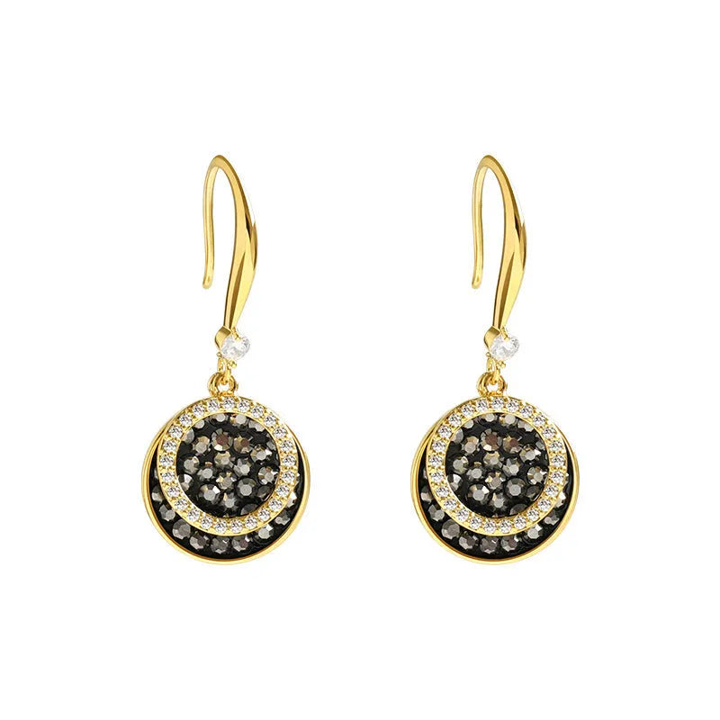 Black retro-style geometric alloy earrings with a round piece, shown from the side.