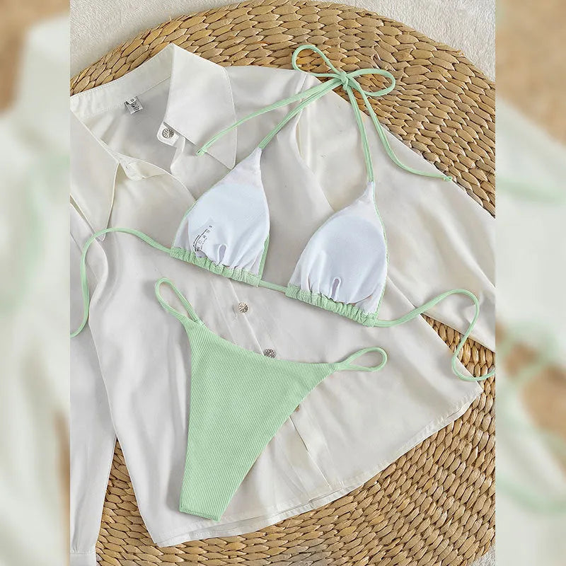 Women's white lace up bikini swimsuit with adjustable front on mannequin