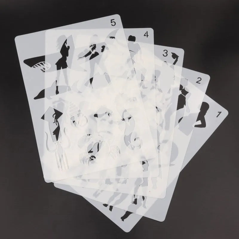 White plastic drawing stencil sets showing multiple pattern designs for art and craft projects