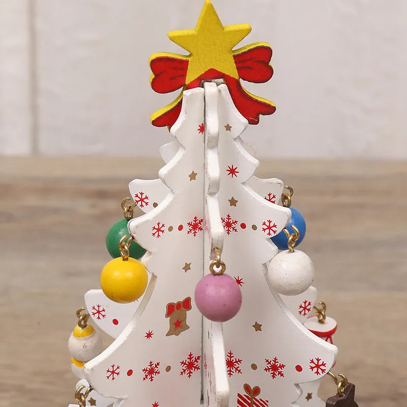 Green MDF Christmas tree ornament with laser-cut detail, 19x10.5cm, on a tree branch