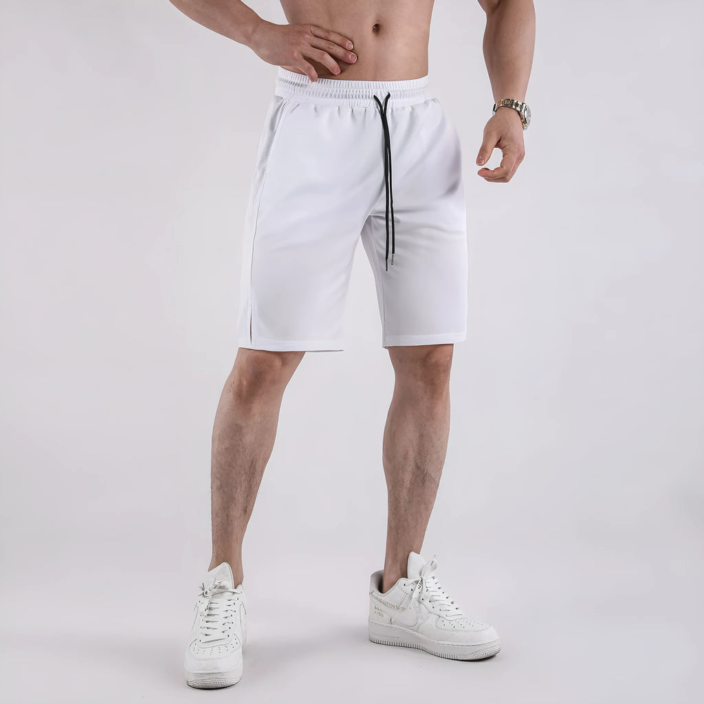 Man wearing black loose-fit quick-dry mesh shorts with an elasticated waistband.
