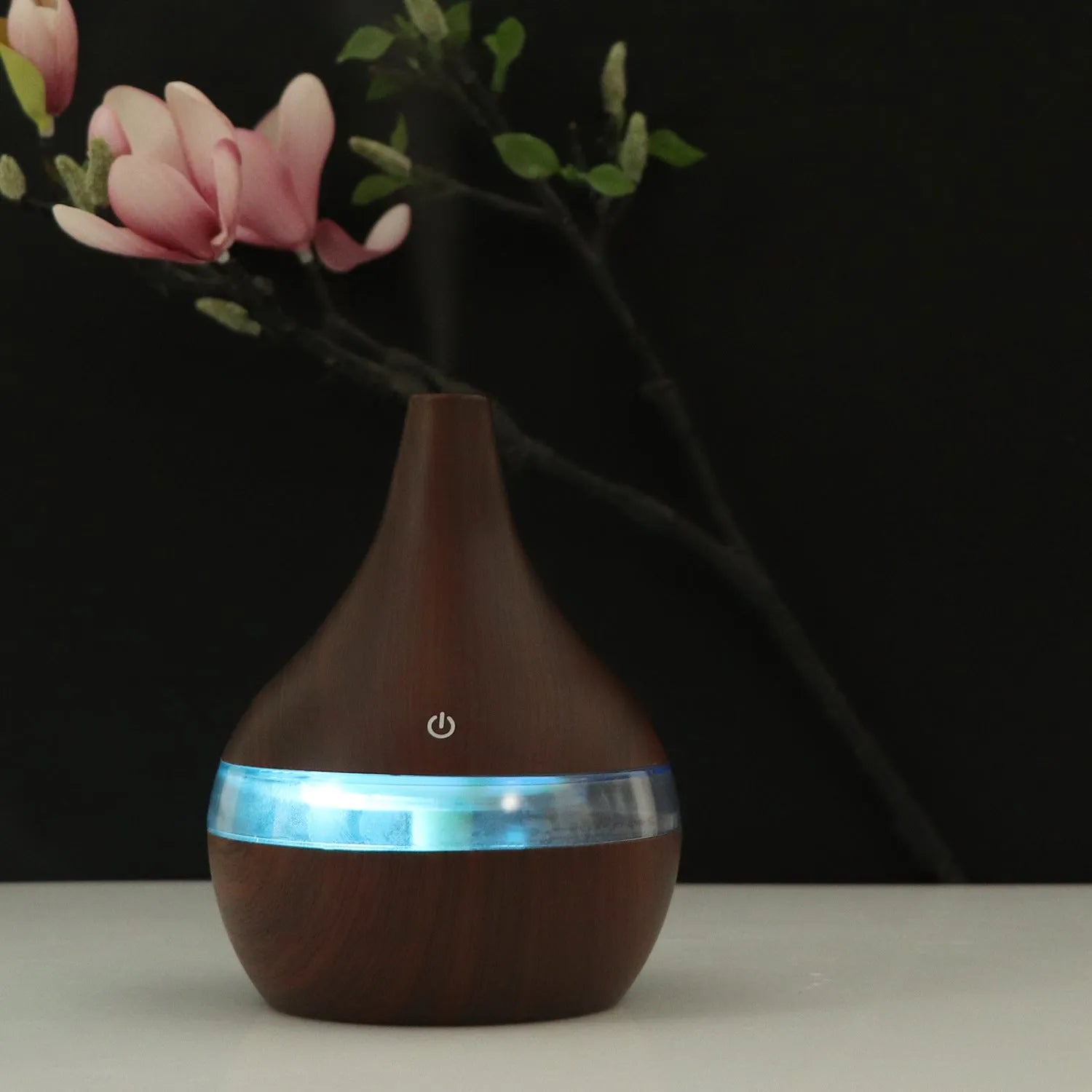 USB-powered mini air purifier humidifier in a wood grain columnar design for small rooms.