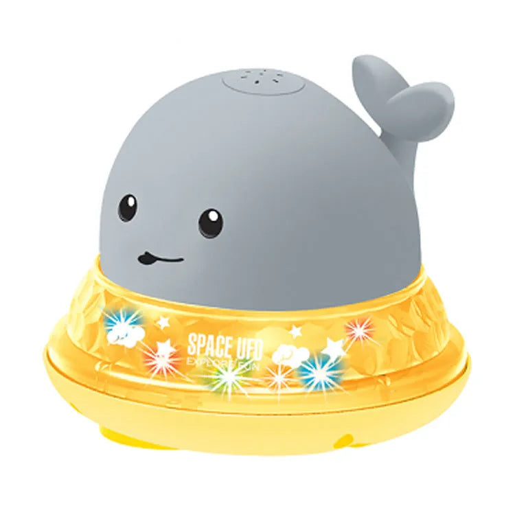 Colourful whale-shaped bath toy spraying water with LED lights illuminated
