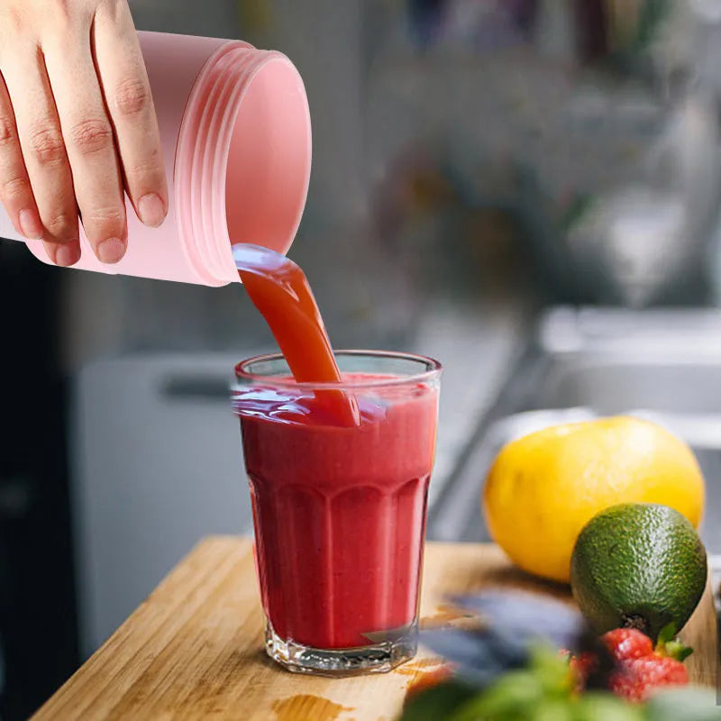 Blue portable USB blender with 450ml cup shown folded and extended next to fruits