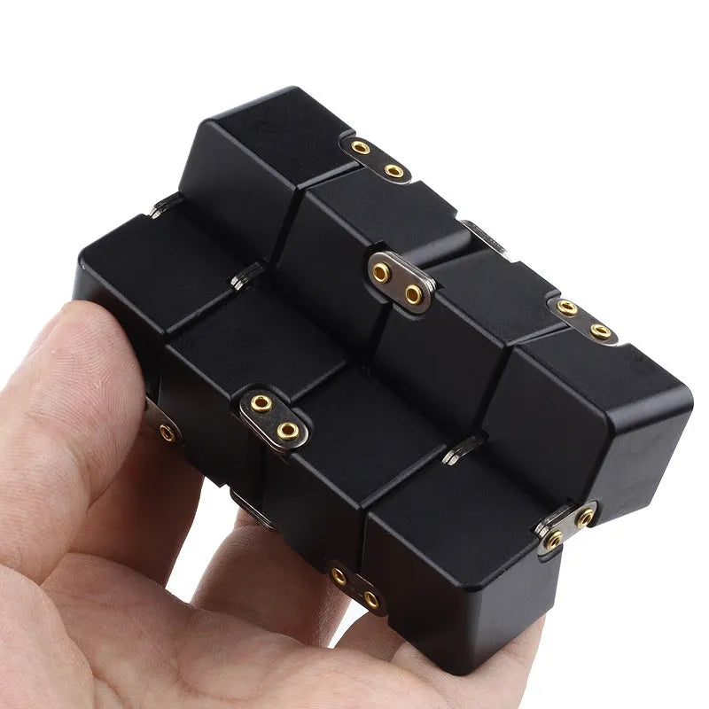 Zinc alloy infinity cube fidget toy showing black metallic finish and rotatable cube design