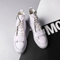 Men's black and white microfiber leather ankle boots in high-top sneaker style, shown with size chart.