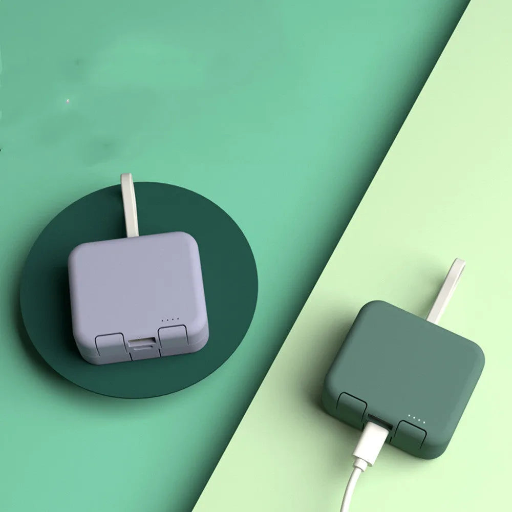 Handbag clip-on power bank with phone stand function in blue, green, red, or white.