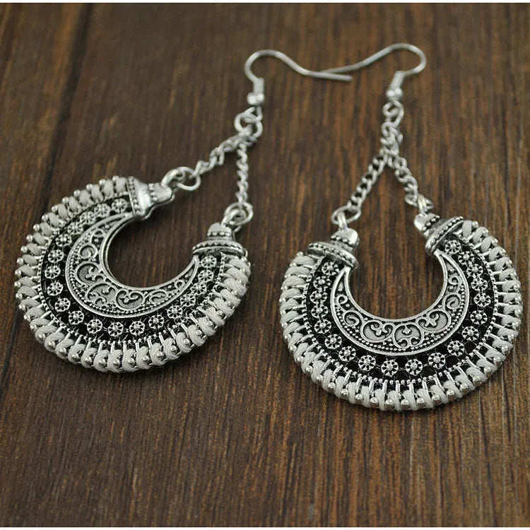 Bohemian vintage alloy and rope U-shaped drop earrings with hollow carved meniscus flower basket design, 5.8cm length, 3.8cm width