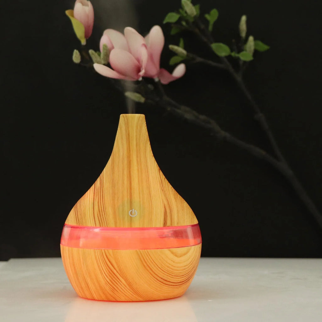 USB-powered mini air purifier humidifier in a wood grain columnar design for small rooms.