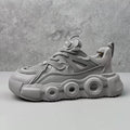 Men's black thick-soled casual sneakers with breathable mesh upper and round toe.