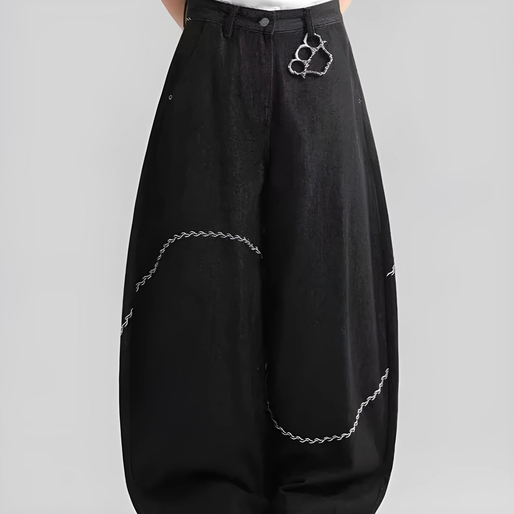 Black straight-leg denim trousers with a mid-waist fit and zip fly, laid flat.