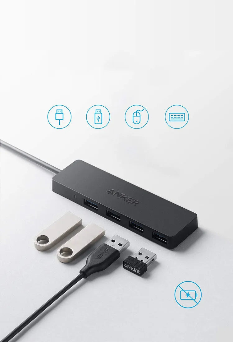 Black Anker 4-port USB 3.0 hub with short attached cable on a desk.
