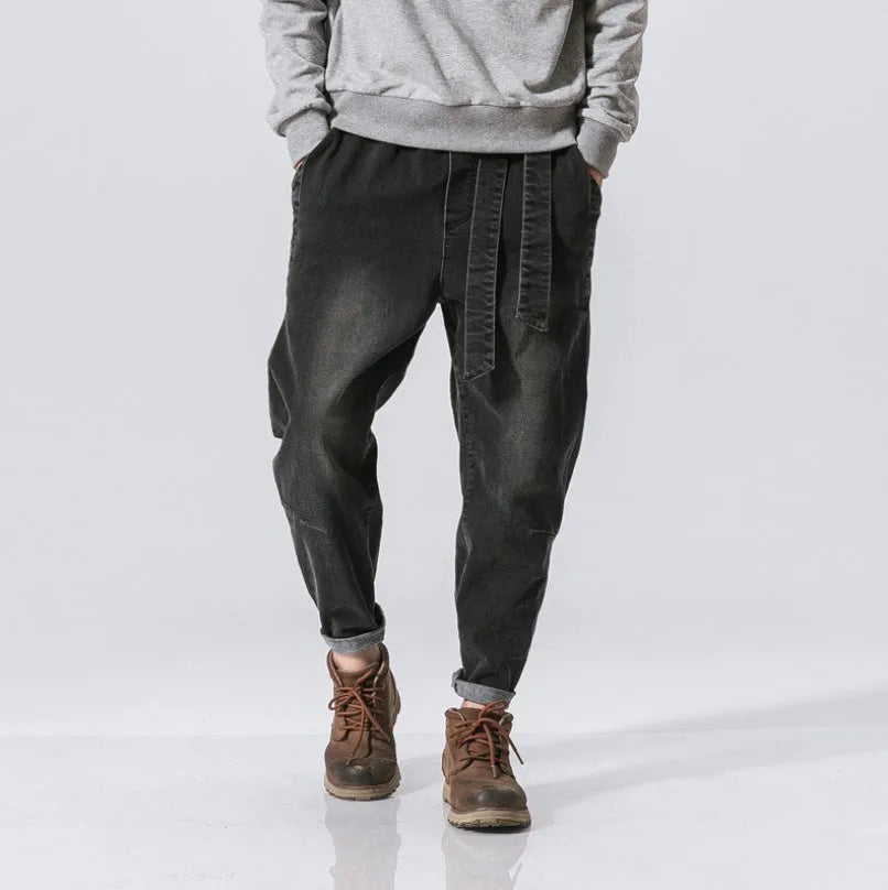 Punk stretch bike denim jeans in solid colour with elastic waist and patches
