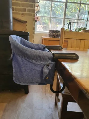 Portable baby dining cover seat with safety belt on a dining chair