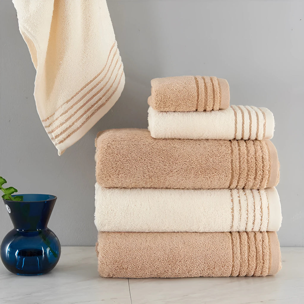 Cotton towel set showing beige and brown options with 34cm and 70cm sizes