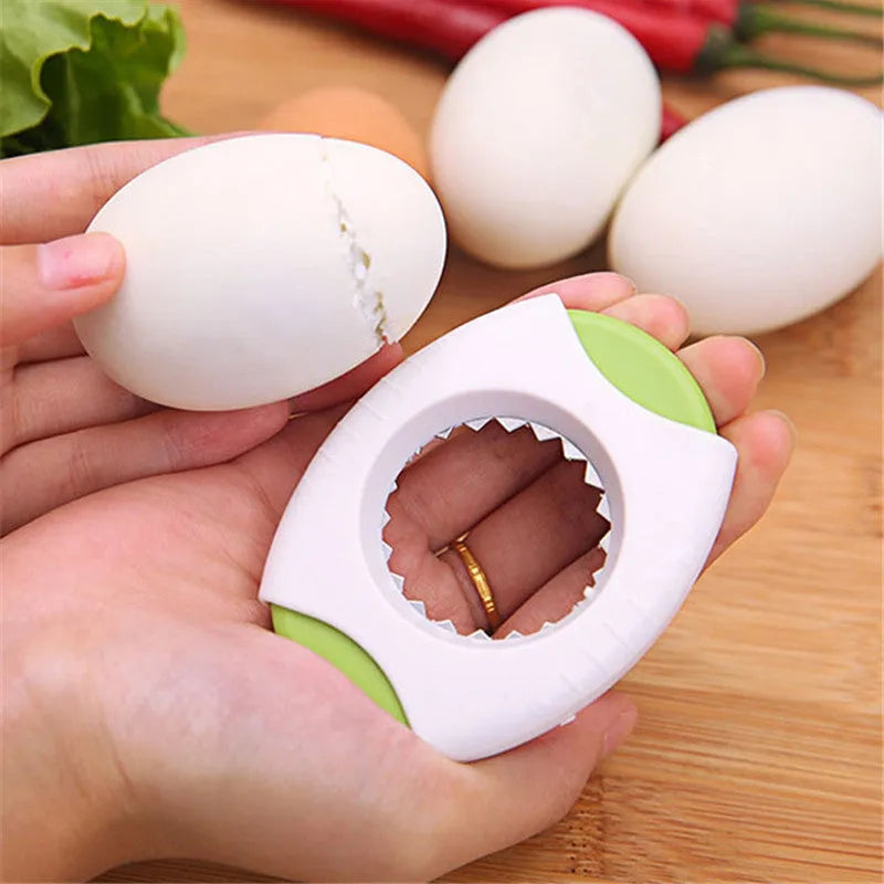 Manual kitchen egg opener with stainless steel cutting edge in green colour, dimensions 8.3 by 5.7 by 1.8 cm