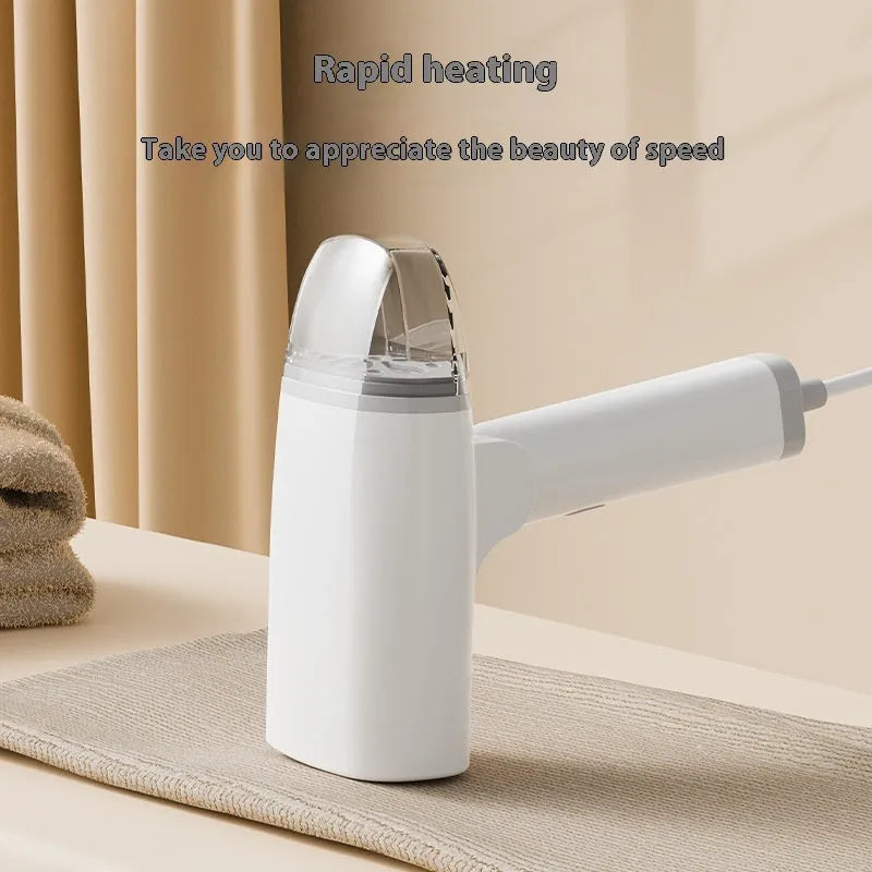 Blue and white handheld garment steamer with power cord and water tank.