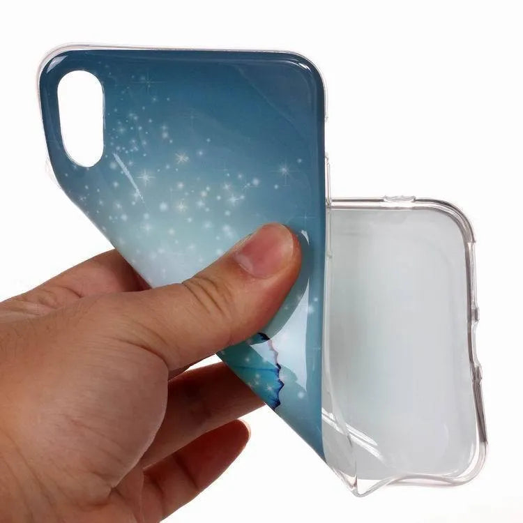 Luminous phone case with cartoon butterfly design for iPhone, glowing in low light.
