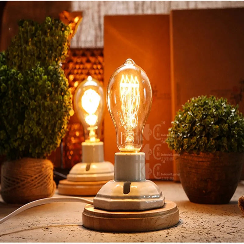 Retro American country style ceramic table lamp with a wooden base and glass shade on a wooden table.