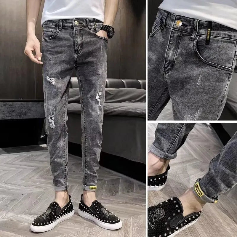 Man's high-waist blue denim jeans with a button fly on a plain background.